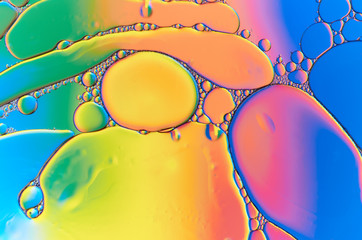 Colorful abstract images of oil drops on water. Colored circles and waves as a concept of...