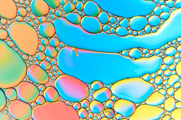 Colorful abstract images of oil drops on water. Colored circles and waves as a concept of...