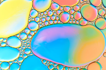 Colorful abstract images of oil drops on water. Colored circles and waves as a concept of...