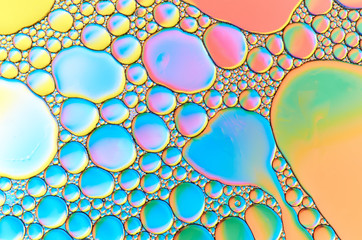 Colorful abstract images of oil drops on water. Colored circles and waves as a concept of...