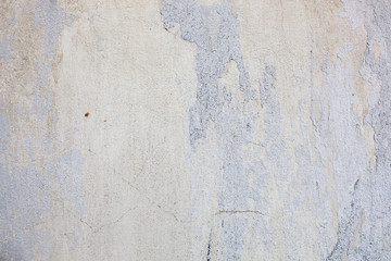 Fototapeta premium Texture of a concrete wall with cracks and scratches which can be used as a background