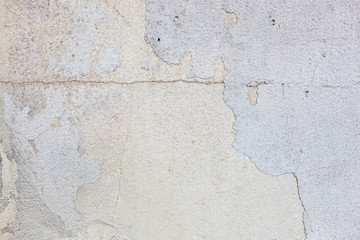 Texture of a concrete wall with cracks and scratches which can be used as a background