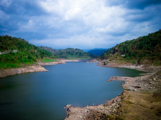 Peaceful Scenery Of Dam Landscape Between The Hills In The Sunny Cloudy Day At Titab Ularan Village, North Bali, Indonesia