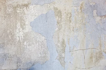 Fotobehang Verweerde muur Textuur van een betonnen muur met scheuren en krassen die als achtergrond kunnen worden gebruikt