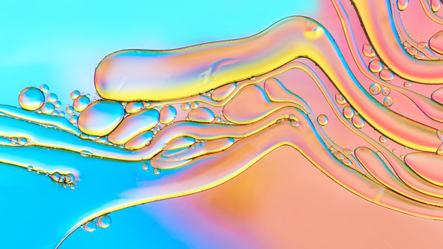 Colorful abstract images of oil drops on water. Colored circles and waves as a concept of scientific discovery, space or molecular research.