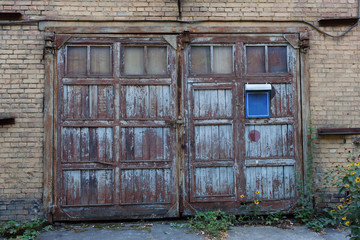 Old vintage wall with worn wooden door