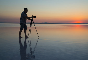 Sunset, lake and photgrapher