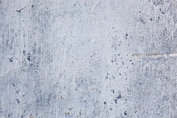 Texture of a concrete wall with cracks and scratches which can be used as a background