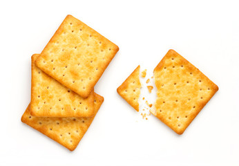 Crushed dry cracker cookies isolated on white background.