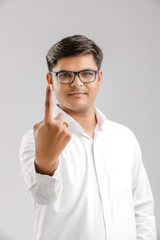 Young Indian voter showing finger 