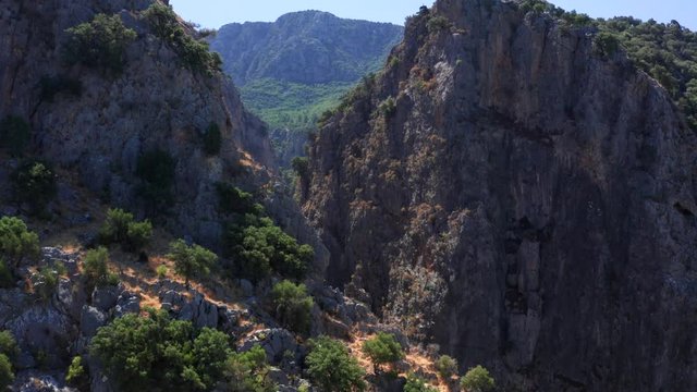  Deep mountain gorge. Aerial view. Close-up.
