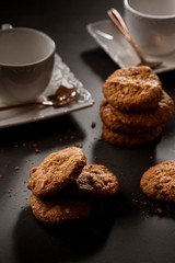 cup of tea and cookies on table