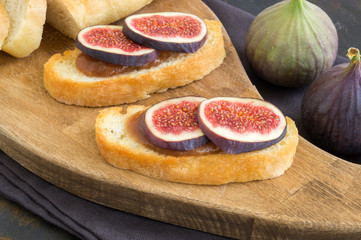 bruschetta with figs on a wooden Board.