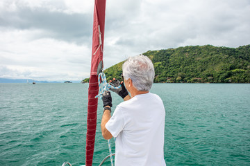 Commander preparing boat for sailing at sea