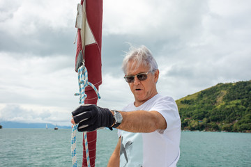 Commander preparing boat for sailing at sea