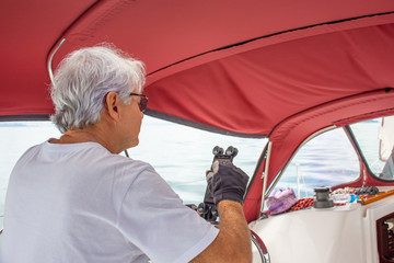 Commander preparing boat for sailing at sea