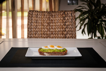 healthy breakfast, advocado toast with eggs and orange juice