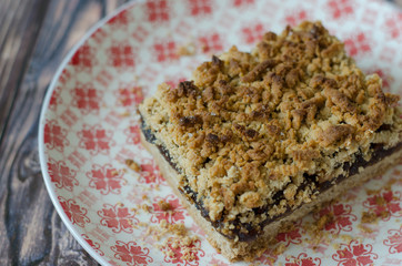 crumble pie with apple jam on a plate