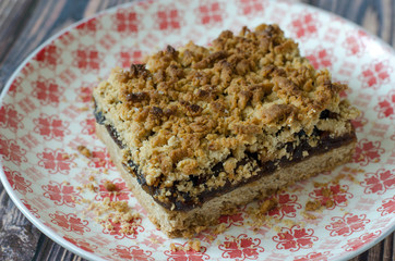 crumble pie with apple jam on a plate