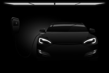 Obraz na płótnie Canvas Black electric car with a charging station in the dark.