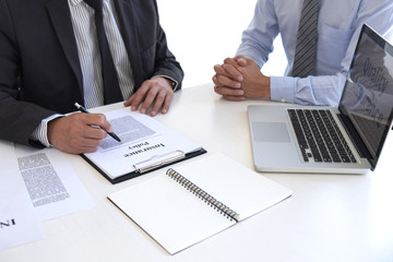 Agent man presentation and consulting life insurance detail to customer and waiting for his reply...