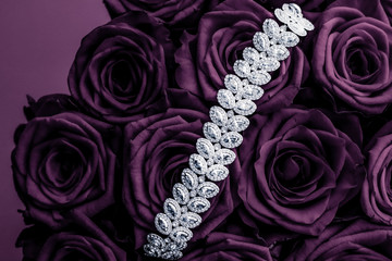 Luxury diamond jewelry bracelet and purple roses flowers, love gift on Valentines Day and jewellery...