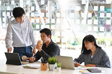 Startup young asian people meeting and talking on coworker space.