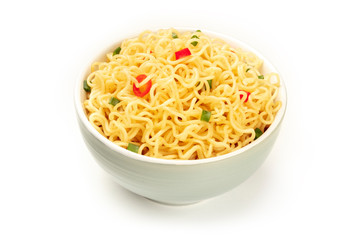 Soba noodles on a white background with red peppers and green onions