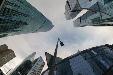 The architecture of ultra modern MIBC (Moscow International Business Center) in the rain autumn day. Business concepts. Fish eye technique/ lens.