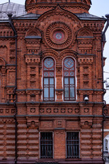 Vintage architecture  red brick facade building with round window front view