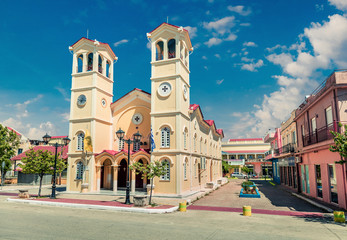 Great morning view of Pantokrator Church. Colorful spring cityscape of  Lixouri town. Bright outdoor scene of Cephalonia island. Traveling concept background. Warm filter toned.