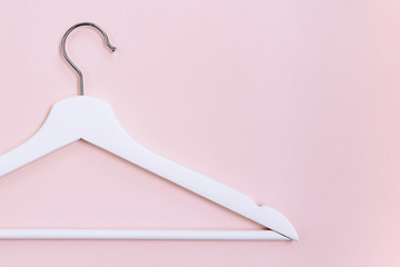 white hanger on pink background