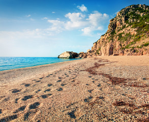Fantastic spring view of Kathisma Beach. Sunny morning seascape of Ionian sea. Wonderful outdoor scene of Lefkada Island, Greece, Europe. Beauty of nature concept background.