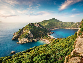Fabulous spring view of Pirates Bay, Afionas village location.Perfect morning seascape of Ionian Sea. Fantastic outdoor scene of Corfu island, Greece, Europe. Beauty of nature concept background. - obrazy, fototapety, plakaty
