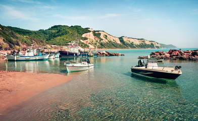 Fototapeta na wymiar Sunny spring view of small port in Gardenos village. Picturesque morning seascape of Ionian Sea. Splendid landscape of Corfu island, Greece, Europe. Traveling concept background.