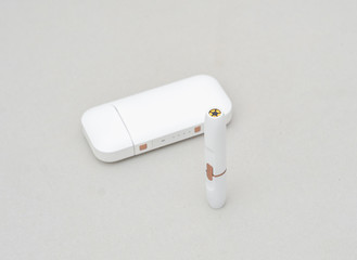 Box-case with a mouthpiece for an electronic cigarette with a white color on a gray background