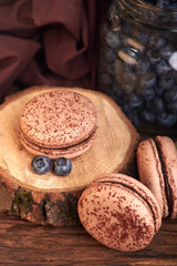 Fototapeta na wymiar chocolate sweet macaroni with blueberry berries. delicious and tasty dessert for coffee