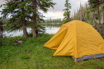 Camping in the Mountains in Yellow Tent