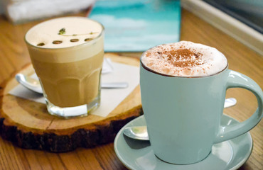 background with two cup of coffee on a wooden table