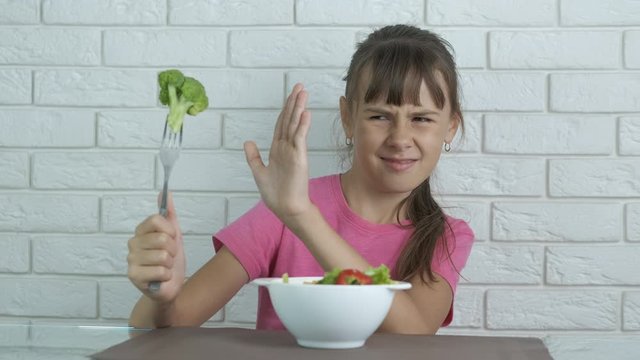 Child with broccoli.