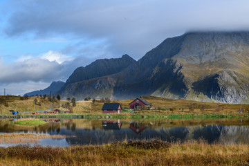 Mirror reflection of mountain in a lake in lofoten islands, Norway. Concept of reflection, peace,...