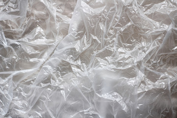 Obraz premium Clear plastic bag texture background. Waste recycling concept. Crumpled polyethylene and cellophane.