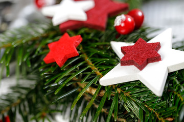 Decoration of handmade red and white advent christmas wreath from fir