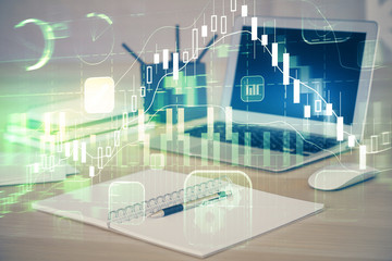 Stock market graph and table with computer background. Multi exposure. Concept of financial analysis.
