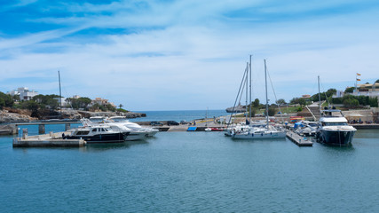Fototapeta na wymiar Mallorca. Tourist town of Porto Cristo. Yachts in the city port