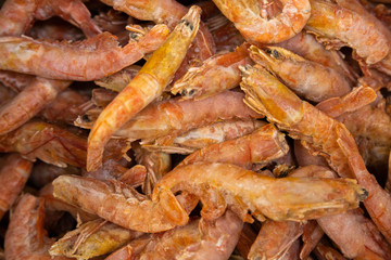 Seafood shrimps, prawns in pile as background for recepies, menu or food industry