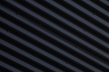 Obraz premium Close-up of metal shiny black corrugated surface