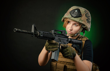 girl in uniform aims with a gun