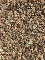 Brick wall made of random stones 