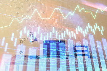 Stock market chart and desktop office computer background. Multi exposure. Concept of financial analysis.